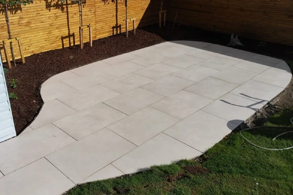 Back garden stone paving installation
