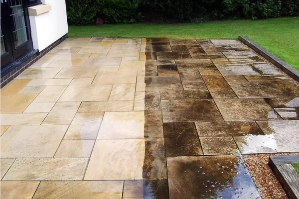 Back patio power washed from the left and dirty on the right